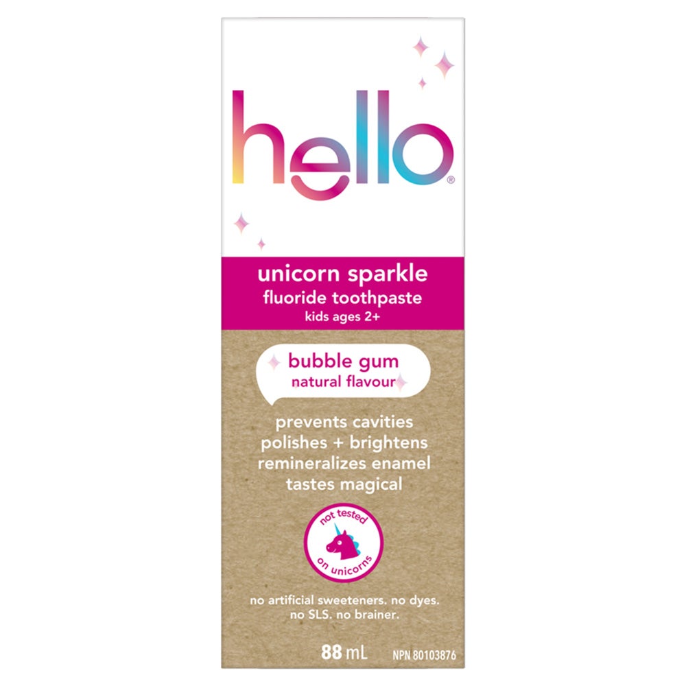 A carton of Hello Unicorn Sparkle fluoride toothpaste for kids ages 2+. The carton features an illustration of a unicorn and text that reads &quot;bubble gum,&quot; &quot;natural flavour,&quot; &quot;prevents cavities polishes + brightens remineralizes enamel,&quot; &quot;tastes magical,&quot; and &quot;not tested on unicorns.&quot; It also lists the features &quot;no artificial sweeteners. no dyes. no SLS. no brainer,&quot; and indicates the size is 88 mL.