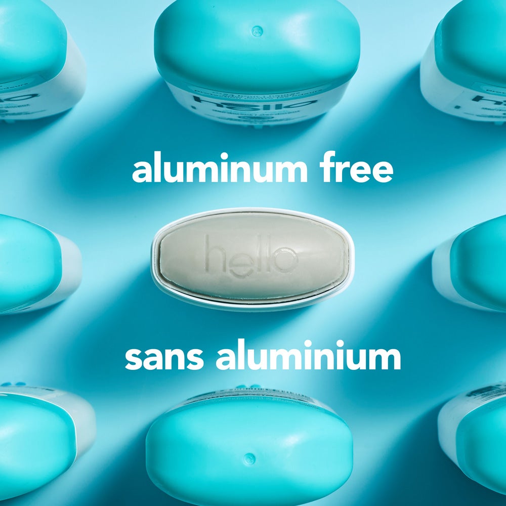 Top view of several hello deodorant sticks with blue caps arranged on a light blue background. The center deodorant has the cap removed, showing the product. Text reads: aluminum free.