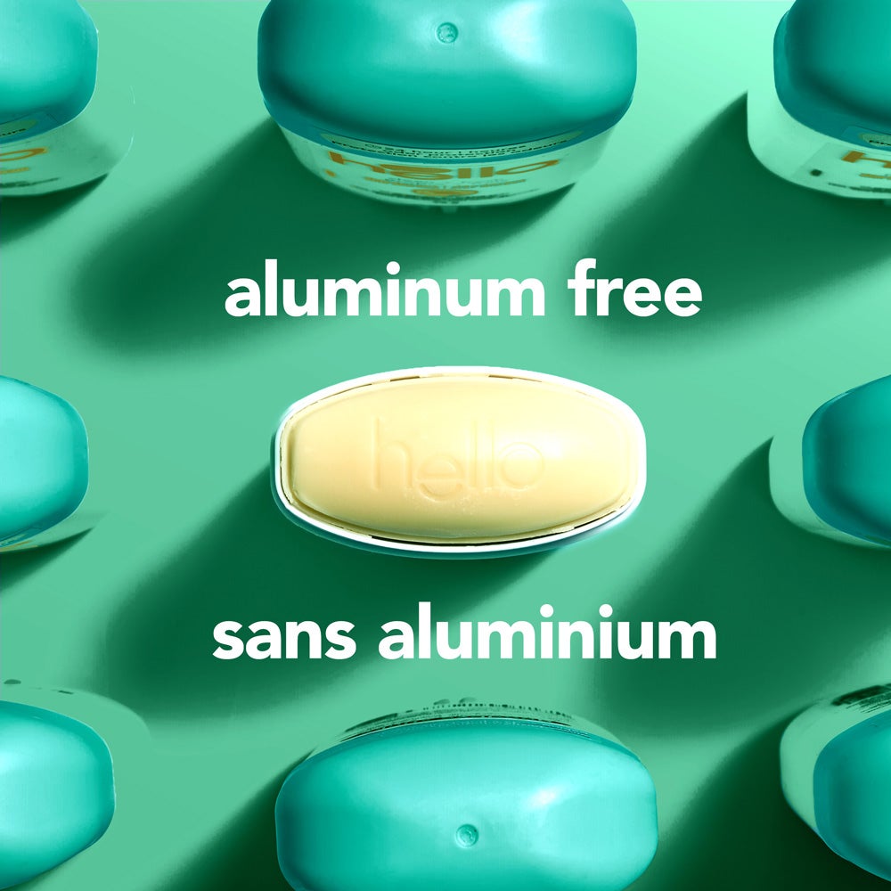 A top-down view of several green deodorant containers arranged around a central oval container embossed with the word &quot;hello.&quot; The image includes the text &quot;aluminum free.&quot;