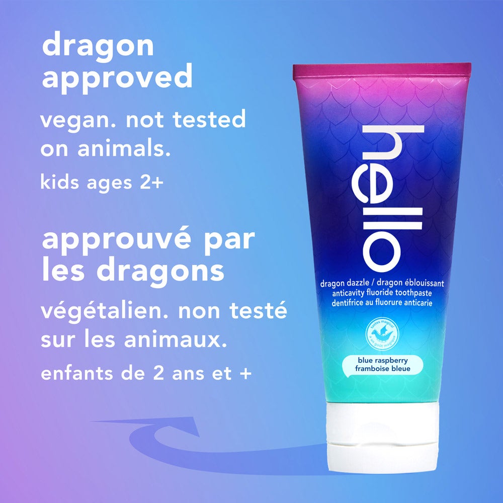 A tube of hello dragon dazzle blue raspberry fluoride toothpaste stands upright on a light blue gradient background. The text beside it reads, &quot;dragon approved, vegan, not tested on animals, kids ages 2+.&quot;