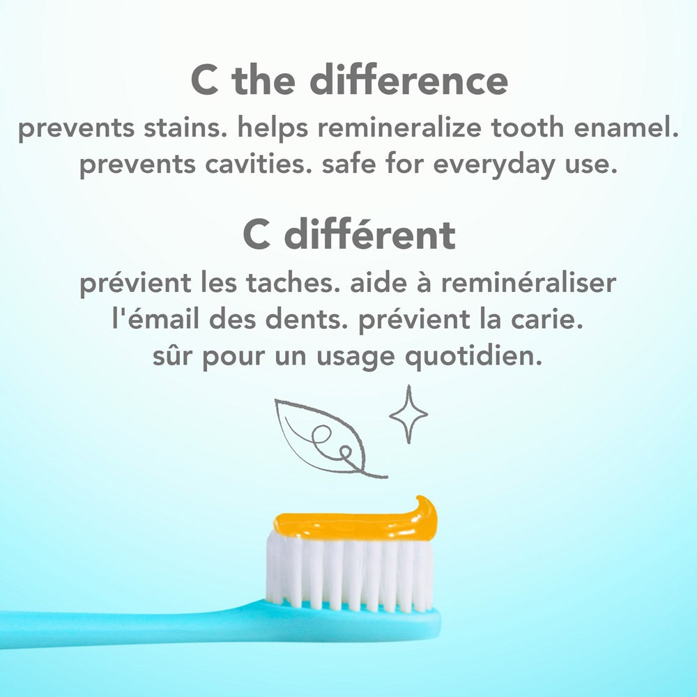 A blue toothbrush with a swirl of the orange hello super mega whitening toothpaste on its bristles, set against a light blue background. The text above the toothbrush reads &quot;C the difference&quot; and lists benefits such as preventing stains, helping remineralize tooth enamel, preventing cavities, and being safe for everyday use, in both English and French.