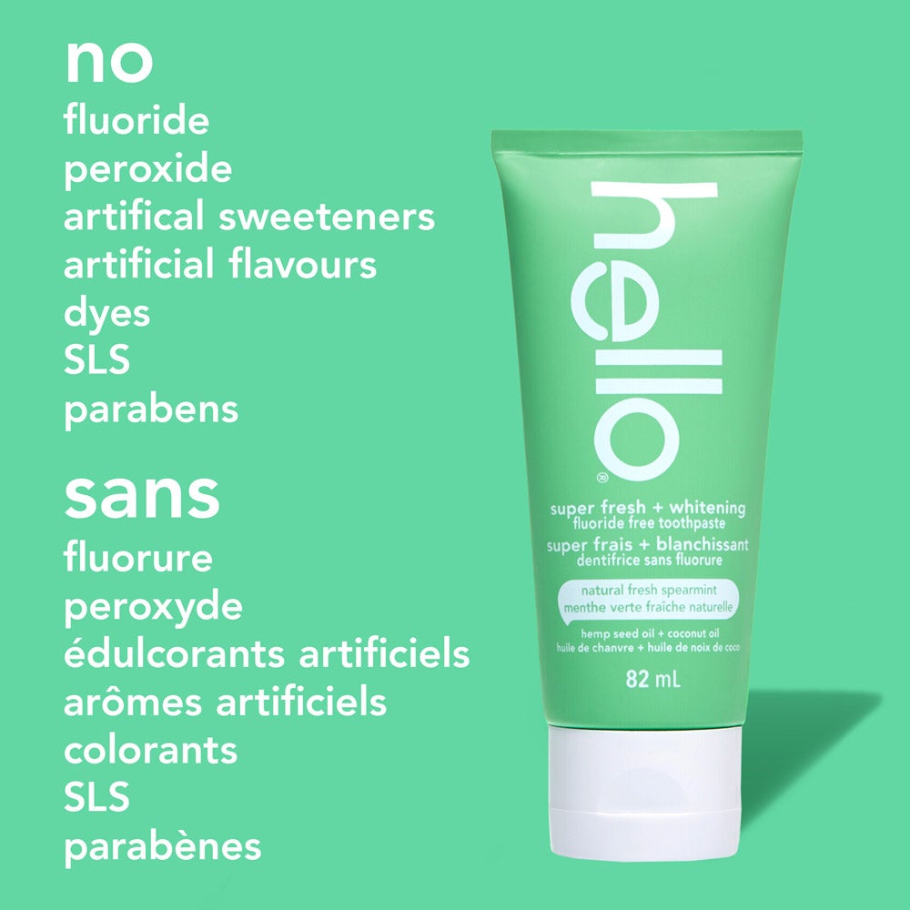 A green tube of hello super fresh + whitening fluoride free toothpaste stands upright on a solid green background. On the left, a list of ingredients not in the toothpaste reads: &quot;no fluoride, peroxide, artificial sweeteners, artificial flavours, dyes, SLS, parabens