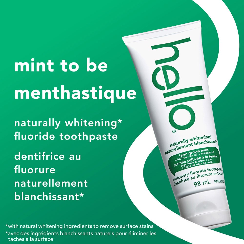 A tube of hello naturally whitening fluoride toothpaste is angled against a green background. Large text says, &quot;mint to be menthastique.&quot; Additional text in English and French notes, &quot;naturally whitening fluoride toothpaste&quot; and explains whitening is with natural ingredients.