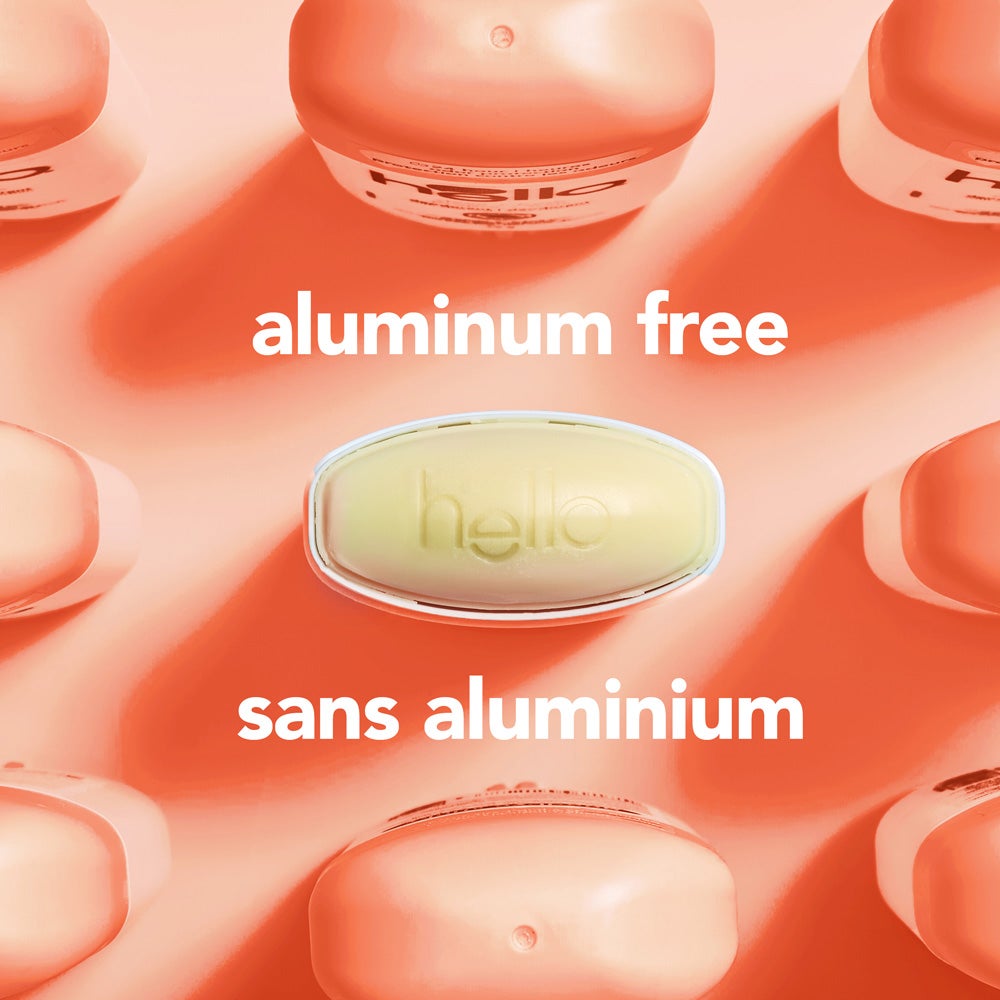 A top-down view of several orange deodorant containers arranged around a central  oval container embossed with the word &quot;hello.&quot; The image includes the text &quot;aluminum free.&quot;