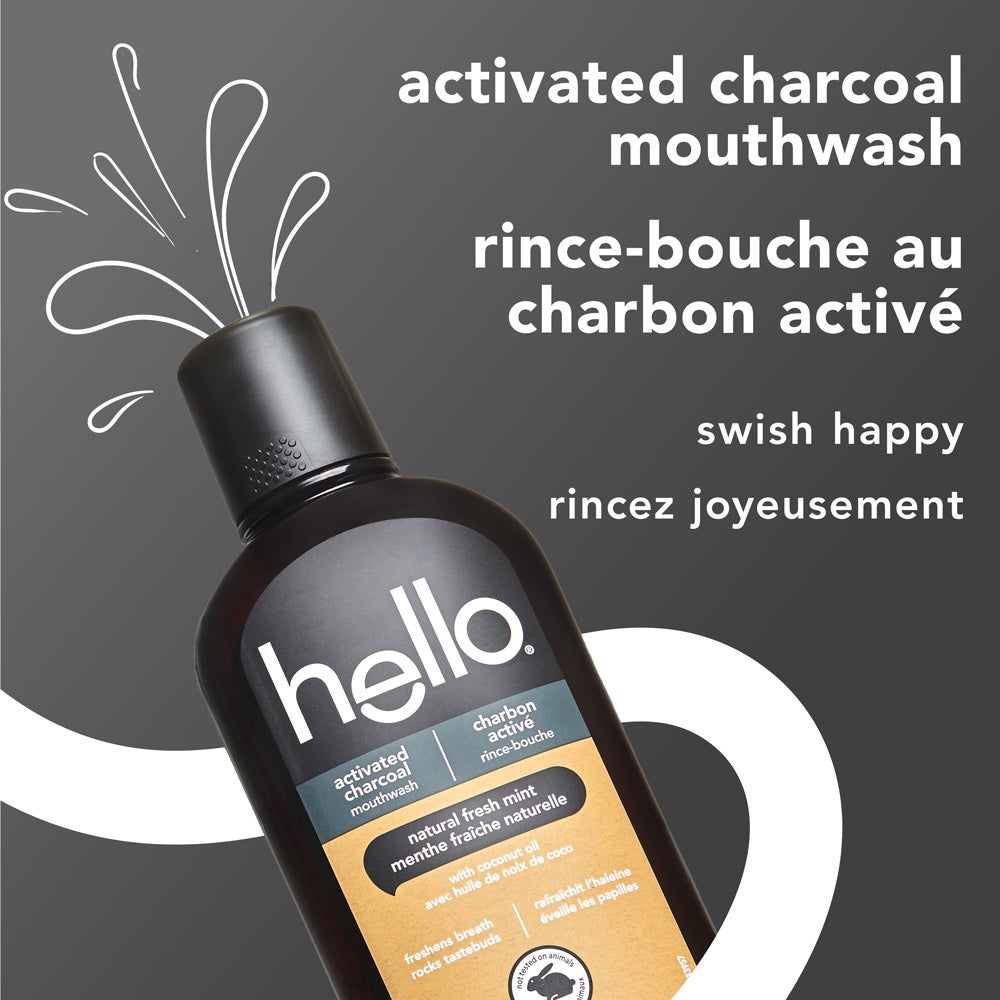 A bottle of Hello activated charcoal mouthwash. It includes the phrases like active charcoal and swish happy.