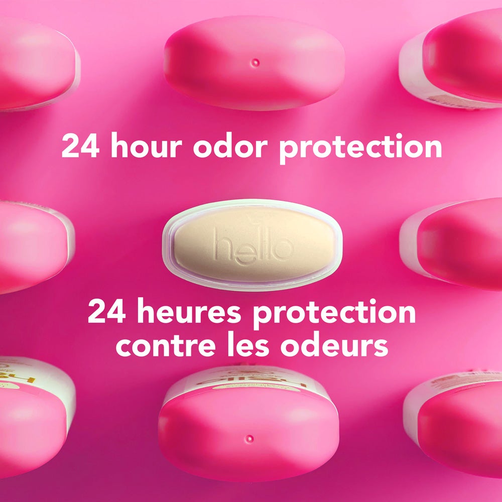 A top-down view of several pink deodorant containers arranged around a central yellow-green oval container embossed with the word &quot;hello.&quot; The image includes the text &quot;aluminum free.