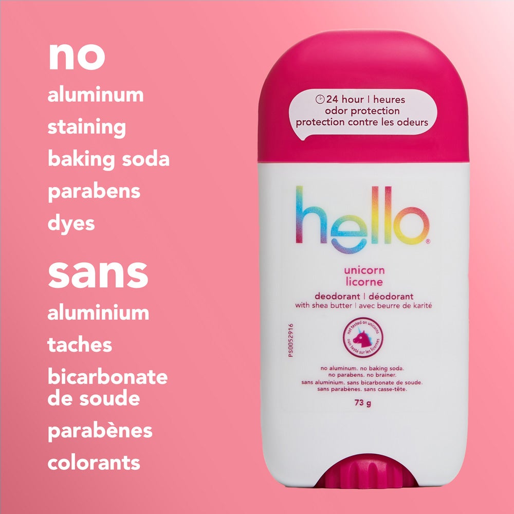 A close-up of a hello unicorn deodorant stick with a pink cap, standing upright on a pink background. The image features text listing product attributes: &quot;no aluminum, staining, baking soda, parabens, dyes.&quot;