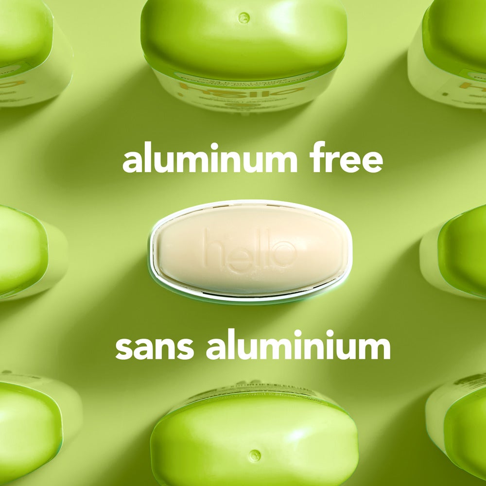 A top-down view of several green  deodorant containers arranged around a central oval container embossed with the word &quot;hello.&quot; The image includes the text &quot;aluminum free.&quot;